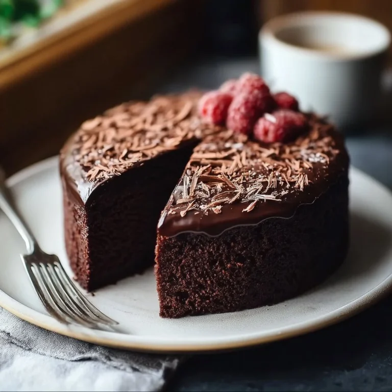 Gluten Free Vegan One Bowl Chocolate Cake topped with chocolate frosting
