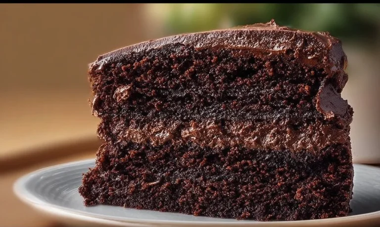 Ultimate decadent gluten free chocolate cake topped with rich frosting